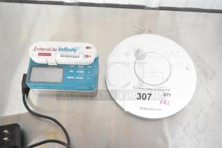 EnteraLite Infinity pump and UniFi UAP-AC-PRO access point, used condition, auction lot 307.