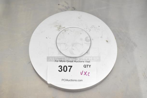 Circular WiFi access port with visible label showing auction lot number 307; surface shows signs of use.