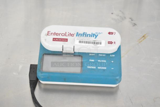 EnteraLite Infinity Pump by Moog, digital display, visible controls. Includes barcode and model identification label.