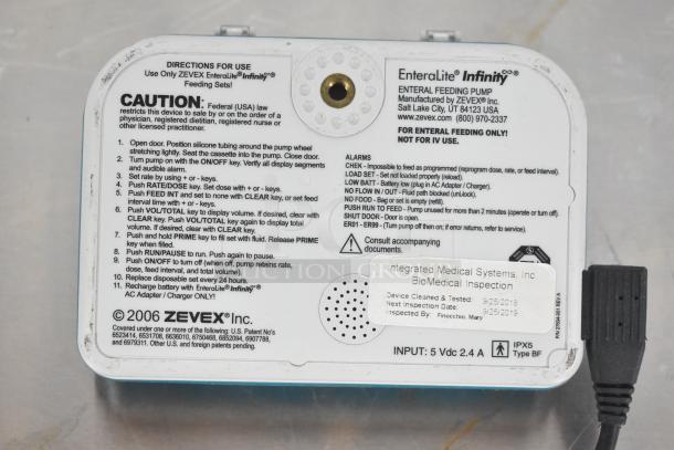 EnteraLite Infinity Pump, ZEVEX Inc., enteral feeding, caution label, medical inspection sticker, clean and tested condition.