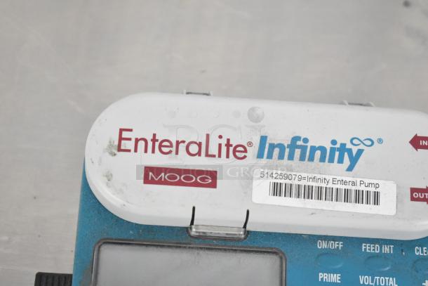 EnteraLite Infinity pump by Moog, visible on/off controls, barcode label. Used condition with slight wear visible.