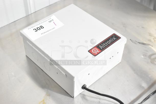 Altronix BH12DC8CB Power Supply Box, white, with manufacturer label and auction tag, in used condition.