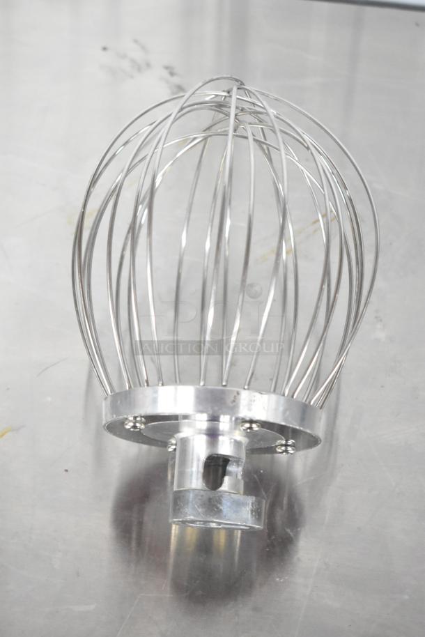 Metal whisk attachment with a sturdy base, in good condition, highlighting shiny stainless steel wires. Ideal for mixers.