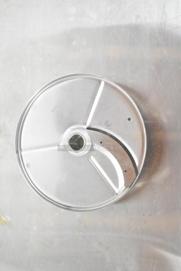 Metal pelican head grating blade with 4mm marking, in good condition, on reflective surface.