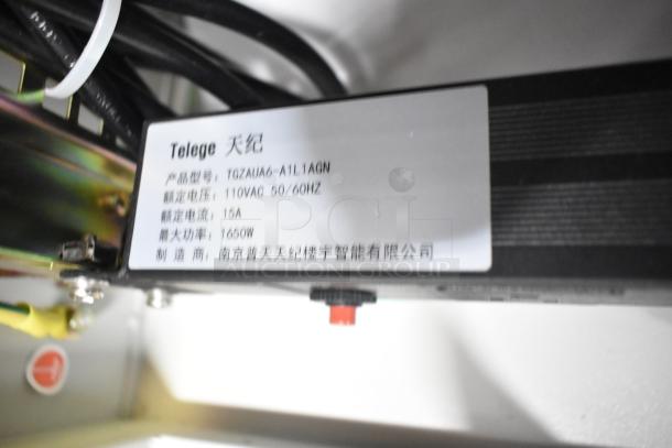 White metal air-conditioned cabinet tag, showing model TGZAUA6-A1L1AGN, 110VAC, 50/60Hz, 15A, 1650W.