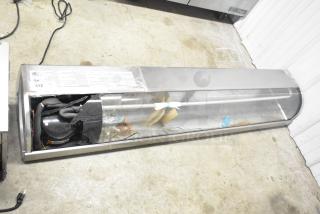 Hoshizaki HNC-180BA-L-SLH refrigerated sushi display case with curved glass, visible wiring, and minor wear. 115V, 1 Phase.