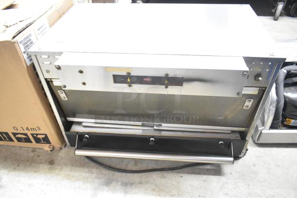 Hatco Commercial Countertop Heated Holding Merchandiser, stainless steel, used condition, visible branding and control panel.