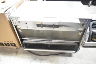 Hatco Commercial Countertop Heated Holding Merchandiser, stainless steel, used condition, visible branding and control panel.