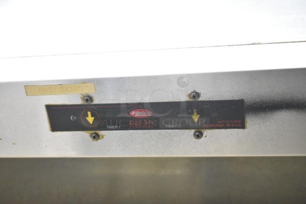 Hatco Commercial Countertop Heated Holding Merchandiser with Glo-Ray food warmer label and hash brown tag, in used condition.