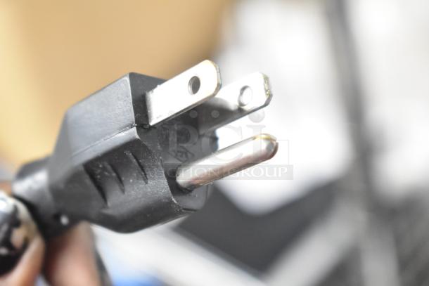 Close-up of a power plug for the 2017 Hobart HTi-LH26 metal commercial countertop food portioning scale.