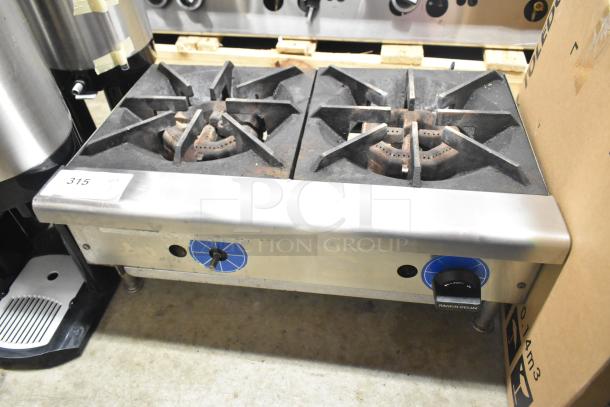 Rankin-Delux commercial countertop 2 burner range, propane gas powered, stainless steel, good condition, model label visible.