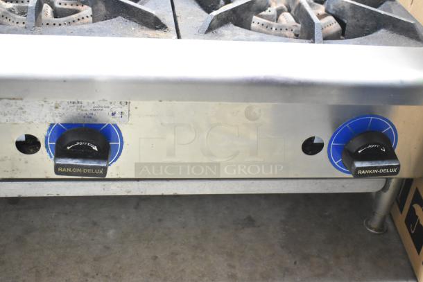 Rankin-Delux 2 Burner Range, propane gas powered, stainless steel, dual control knobs, used condition.