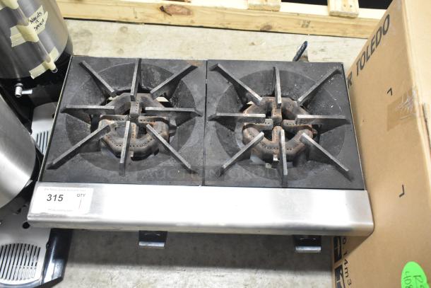 Rankin-Delux 2 burner propane gas range, commercial countertop model, visibly used, sturdy cast iron grates, auction tag shows item 315.