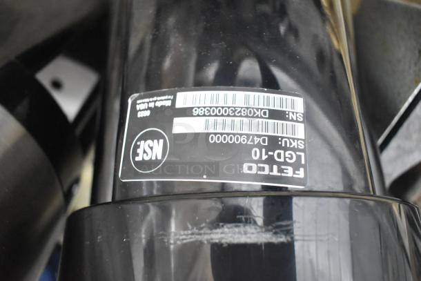 Fetco Luxus LCD-10 Beverage Dispenser, black, NSF approved, with visible model and serial number labels, good condition.