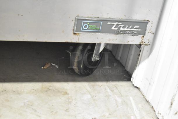 2016 True TSSU-48-18MB-HC prep table, visible on commercial caster, showing logo and natural refrigerant label. Rust noted.
