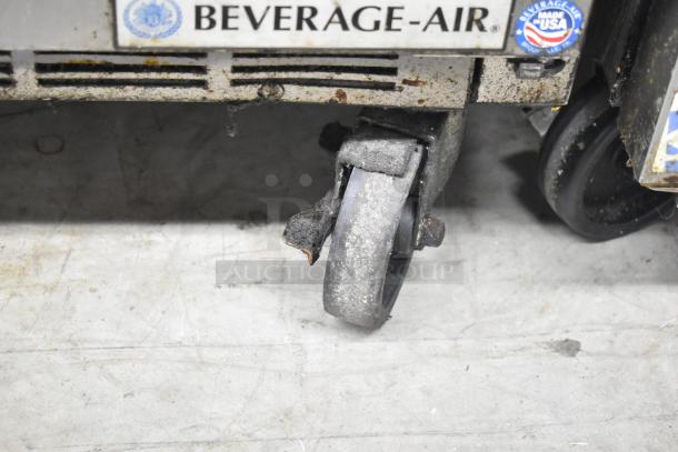 Beverage Air SPE48-18M-HMP prep table on commercial caster, visible wear, labels indicate make and USA production. 115 Volts, 1 Phase.