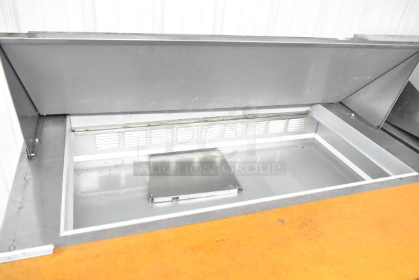 Beverage Air SPE48-18M-HMP prep table, mega top, used condition. Features bain marie design, commercial casters.