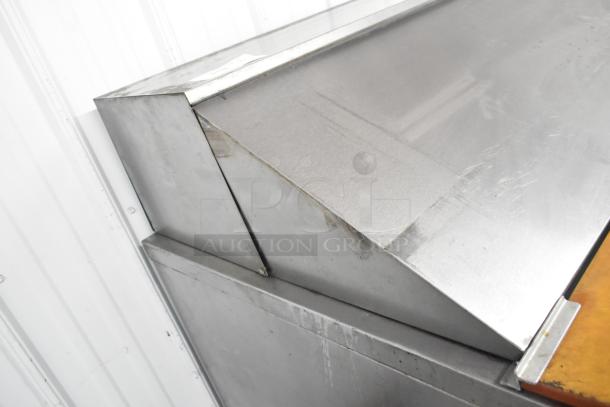 Beverage Air SPE48-18M-HMP commercial prep table, stainless steel, scratches visible, 115V, 1 phase, on commercial casters.