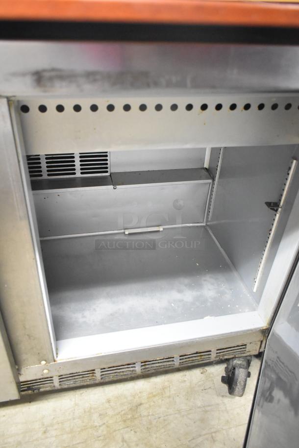 Beverage Air SPE48-18M-HMP sandwich salad prep table, visible interior storage, on commercial casters, 115 volts, 1 phase.