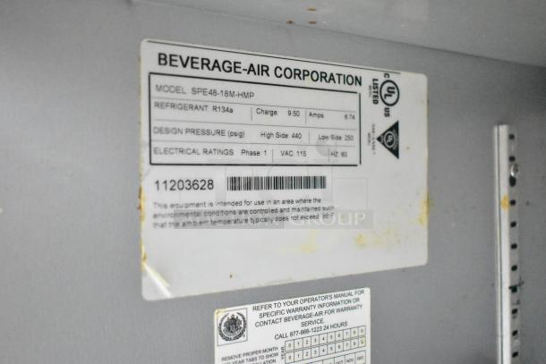 Beverage Air SPE48-18M-HMP commercial sandwich salad prep table, label showing model, refrigerant, and electrical specs.