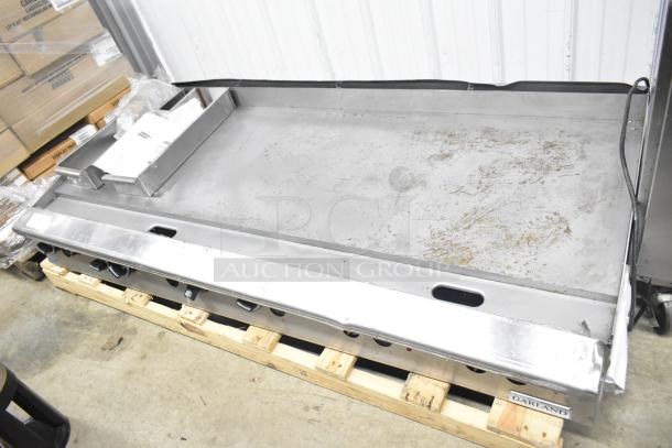 Garland Commercial Gas Flat Top Griddle, countertop model, stainless steel, used condition, visible griddle surface wear.