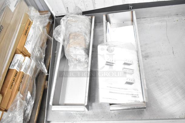 Garland Commercial Gas Griddle, countertop model, flat top, stainless steel, new in box with manuals and packaging visible.