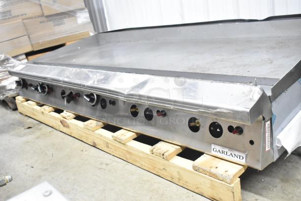 Garland Commercial Countertop Gas Griddle, stainless steel, multiple control knobs, used condition, on wooden pallet.