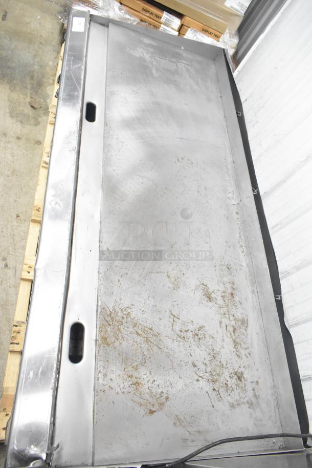 Garland Commercial Gas Flat Top Griddle, stainless steel, countertop model, visible surface wear, suitable for heavy-duty use.