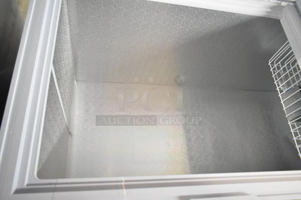 BRAND NEW KoolMore SCF-24C commercial chest freezer, 24 cu ft, interior view, slight scratches, wire basket, 115V, 1 phase.