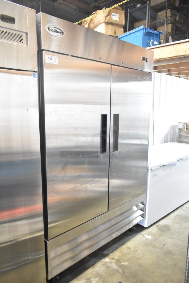New KoolMore RIR-2D-SS 2-door commercial cooler, stainless steel, on casters, 115 Volts, slight scratches visible.