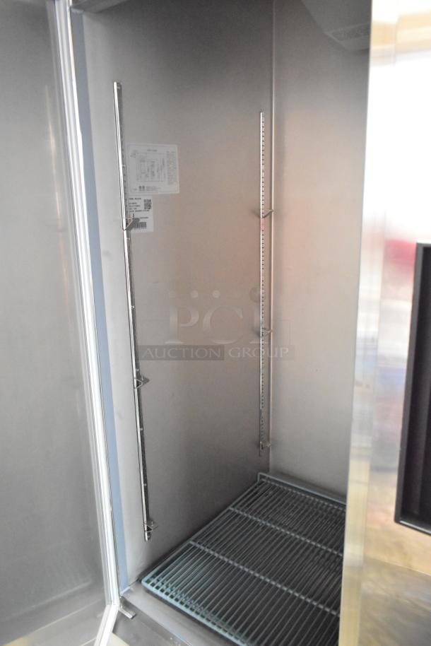 New KoolMore RIR-2D-SS 2-Door Reach-In Cooler, scratch and dent, commercial casters, interior shelving, 115V, 1 phase.