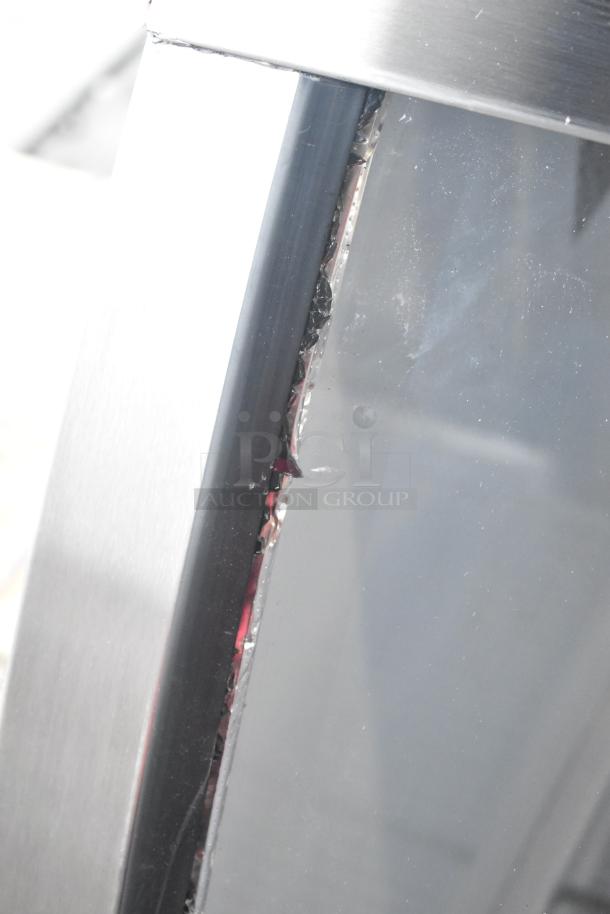 Brand new Avantco 178DLC82HCS refrigerated deli case showing broken curved glass, 115 Volts, 1 Phase.