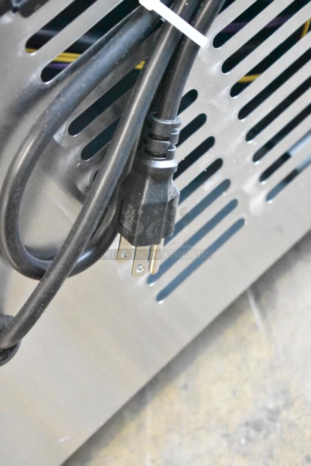 Power cord and vent detail of Avantco 178DLC82HCS Commercial Curved Glass Refrigerated Deli Case, 115V, 1 Phase.