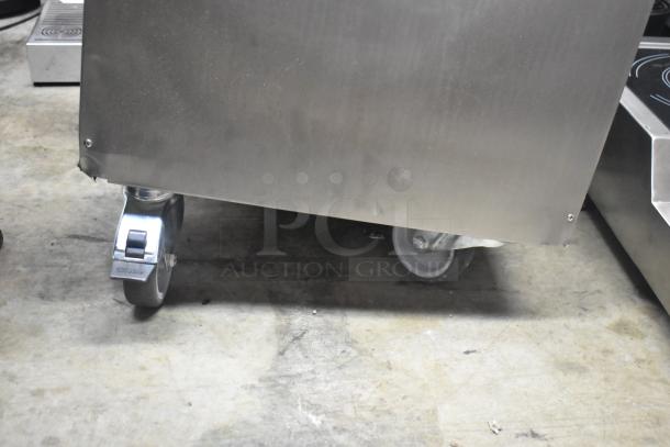 Brand new Vito Fryfilter XM 137 lb. mobile fryer oil filter system, 100-120 volts, 1 phase, showing caster wheels, slight dents.