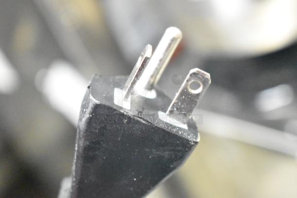 Close-up of a three-prong power plug, compatible with Avantco 177IC35SU Induction Range, 208-240V, 1 Phase.