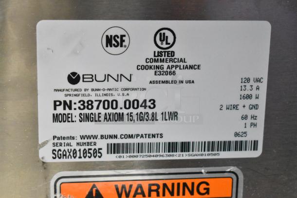 Label on Bunn SINGLE AXIOM 15 coffee brewer. Model 38700.0043, 120V, 1600W, 1 Phase. NSF, UL listed, assembled in USA.