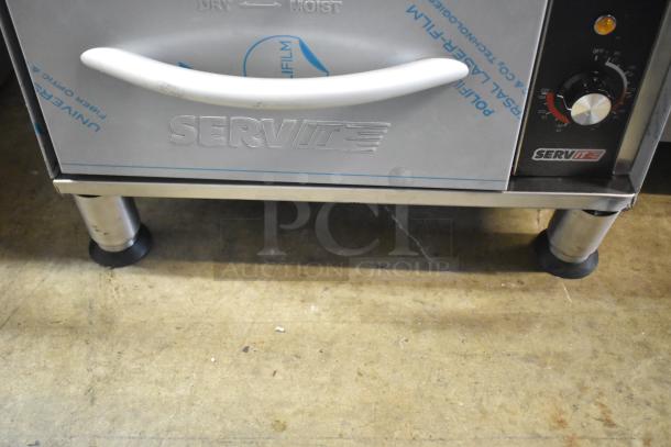 BRAND NEW ServIt 423WDNFS1 drawer warmer, 120V, single narrow, freestanding. Minor scratches. Model label visible.