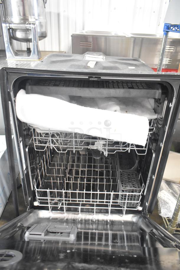 BRAND NEW Whirlpool WDT750SAKZ2 undercounter dishwasher, 115V, 1 phase, with visible scratch and dent.