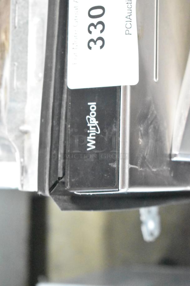 Brand new Whirlpool WDT750SAKZ2 undercounter dishwasher, 115V, 1 phase; visible scratch and dent on exterior panel.