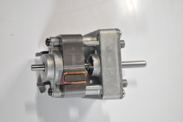 Brand new Hatco gear motor, model 02.12.096.00 HP021209600, showing minor scratches. Silver finish, compact design.