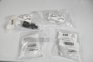 Four new Turbo Air and Scotsman refrigeration parts, including defrost sensors and chute flap, in original packaging with labels.