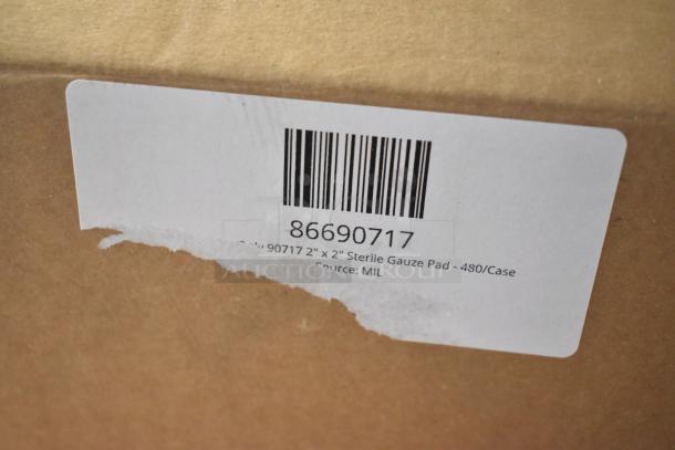 Box with label reads "86690717," containing 11 new scratch and dent items, including tweezers, medicine, bandages, and eye pads.