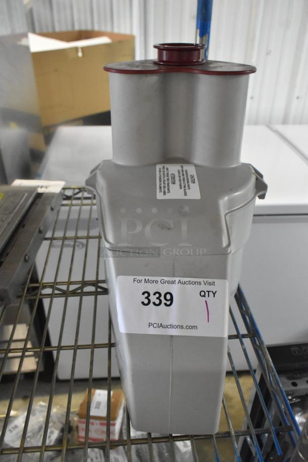 Brand new, scratch and dent gray poly continuous feed head for food processor, item 339, with attached label from PCI Auctions.
