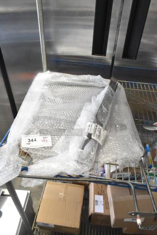 Brand new Vulcan strip grease and element on shelf; includes labels with model numbers 00-976616-00002, 00-927538-0006S.