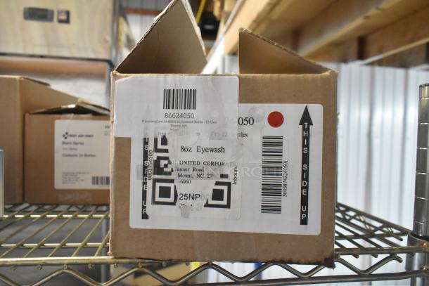 Box of PhysiciansCare 24-050 8 oz. Eyewash, 12/Case, labeled, with barcode, on metal shelf.