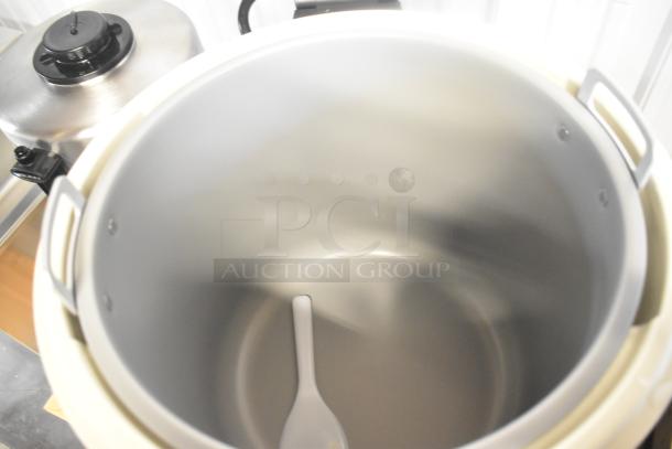 Brand new Zojirushi THA-803S 88 cup electric rice warmer, stainless steel, with removable pot and minor scratches.