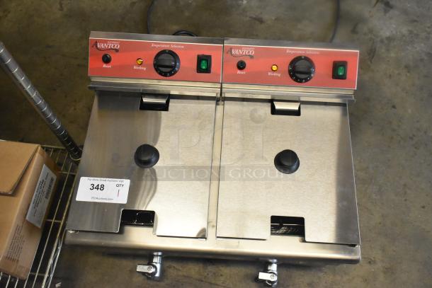 Brand new Avantco 177F202 dual tank electric fryer, 30 lb. capacity, with two metal baskets and lids. Scratch and dent condition.