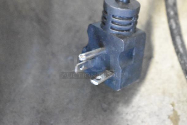 Close-up of electric plug for Avantco 177F202 dual tank fryer, showcasing prongs and cord for 208-240 volt connection.