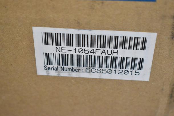 Panasonic NE-1054F Commercial Microwave in original box, with visible barcode and serial number 6C85012015.