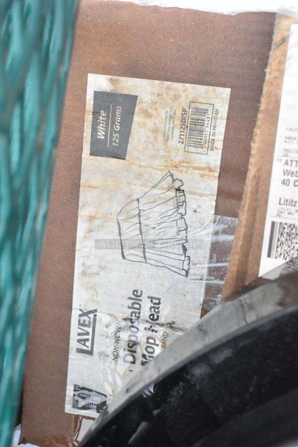 Alt text: Lavex non-woven disposable mop head packaging, white 125 grams, minor wear visible, included in scratch and dent auction.